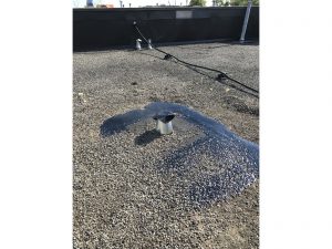 Breather vent repair flat roof in Oshawa