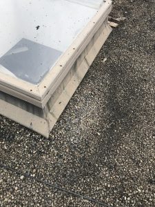 Damaged skylight on flat roof in Toronto