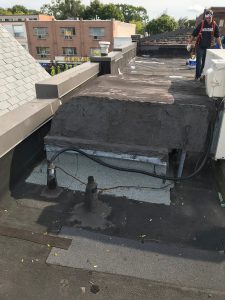 Flat roof repairs at electrical conduit in Toronto
