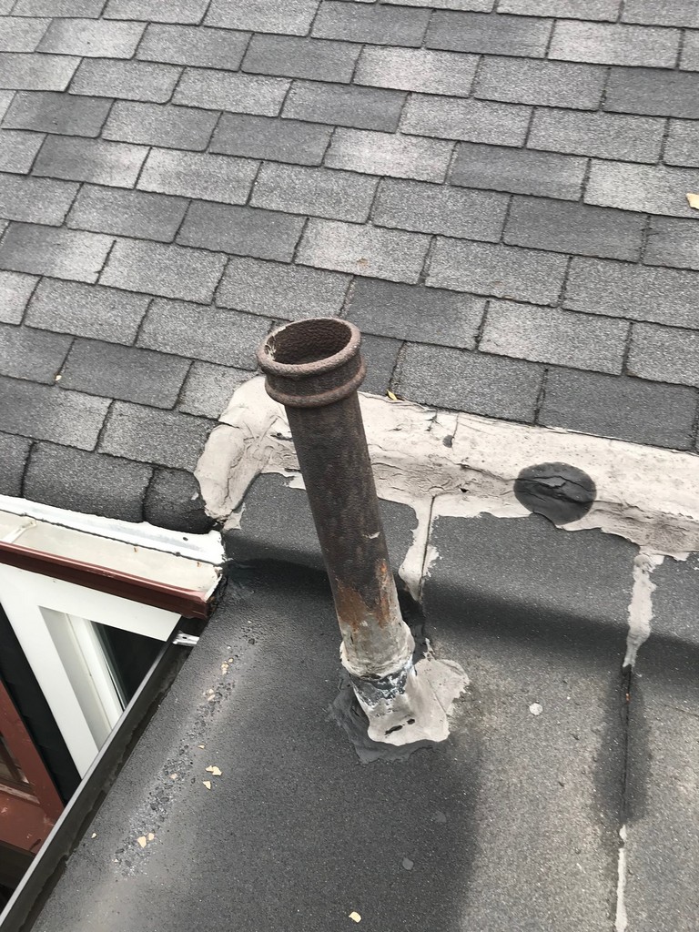 Modified bitumen flat roof repair on home in Toronto