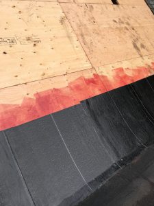 Peel and stick Soprema membrane on flat roof in Toronto