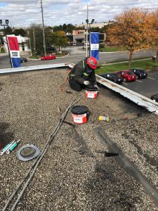 Flat roof inspection of deteriorated membrane roof in Toronto
