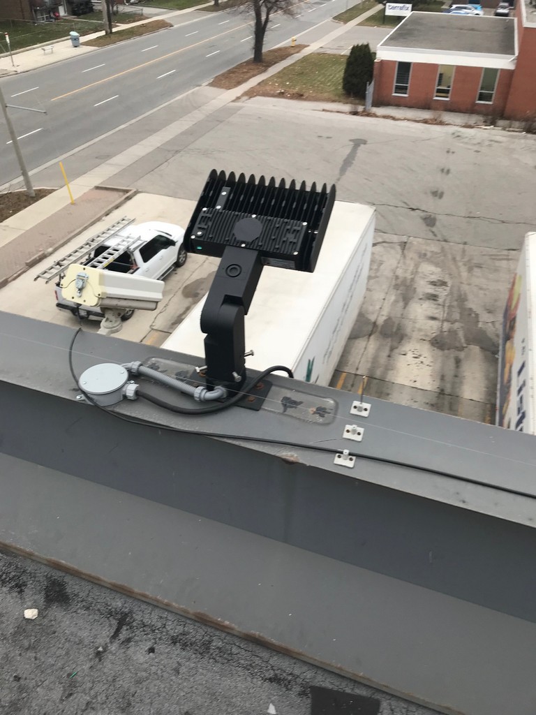 LED light mounted on metal coping on commercial building in Etobicoke