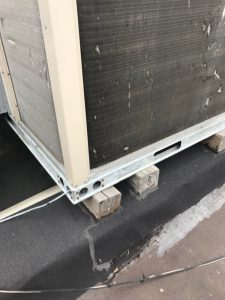 Sleeper mounted AC unit on modified bituminous roofing in Toronto