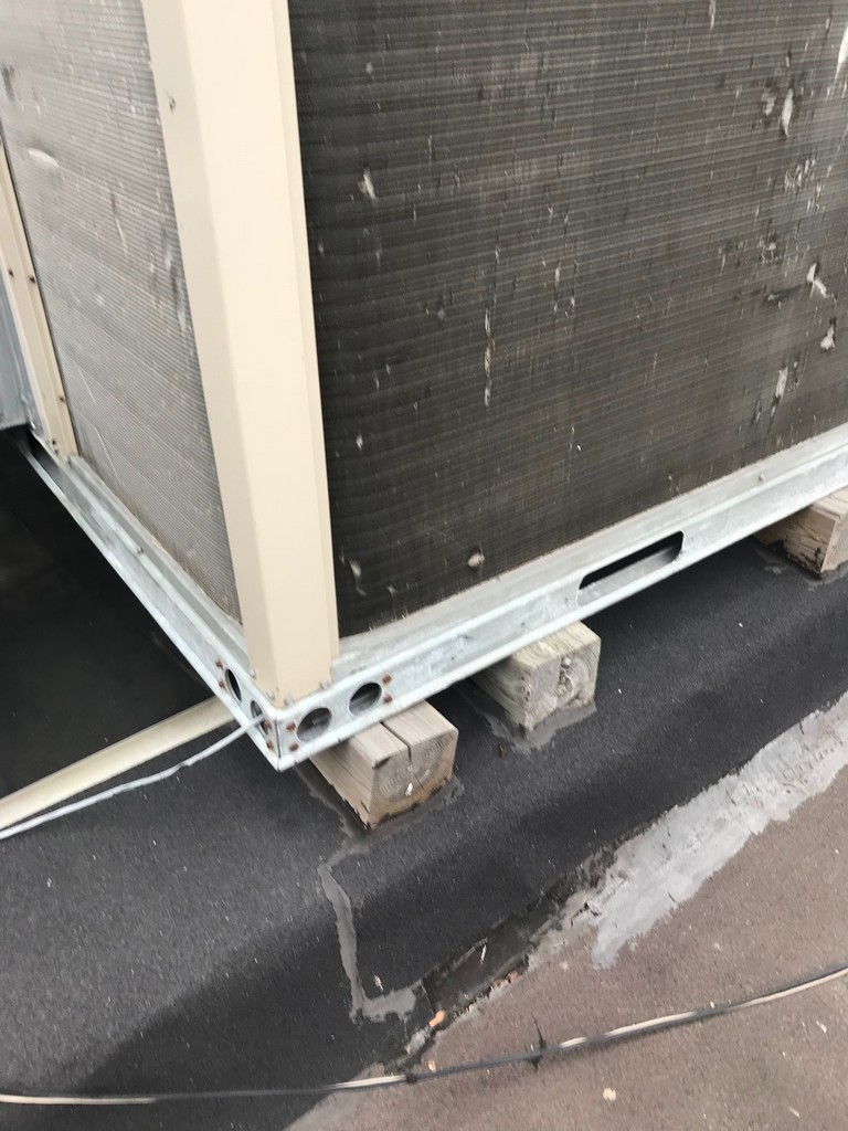 Sleeper mounted AC unit on modified bituminous roofing in Toronto