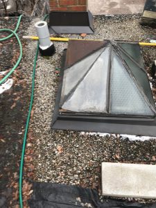 Skylight repair on tar and gravel roof in Toronto