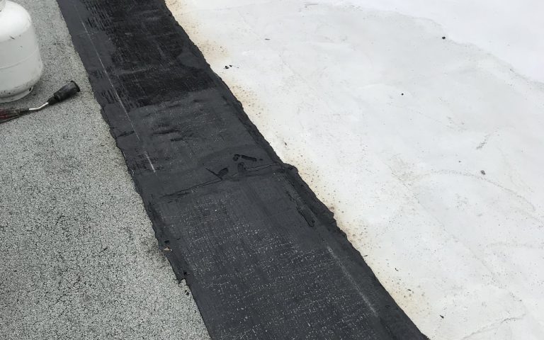 Sopralene Flam 180 flashing strips on flat roof in Toronto
