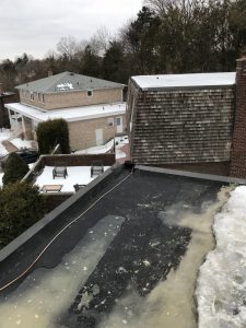 Scupper drain flushed with Sopralene Flam Granules on flat roof in don mills