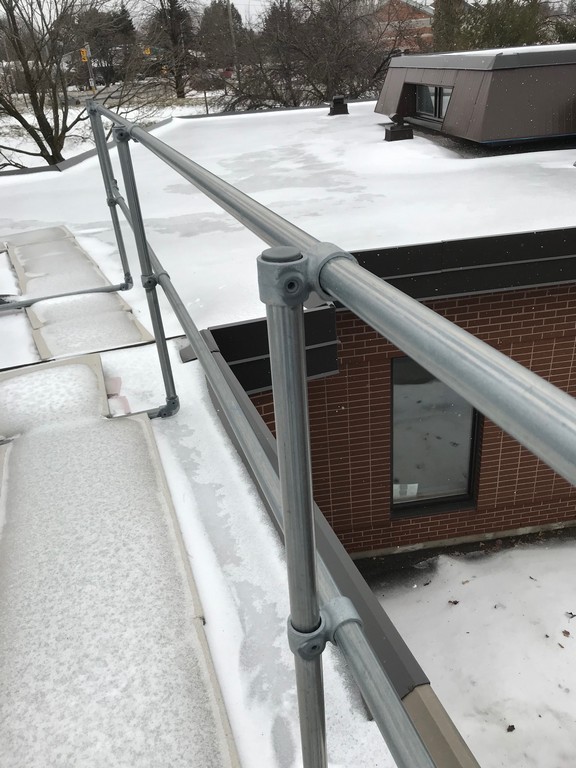 Metal guard rail system on commercial flat roof in Markham