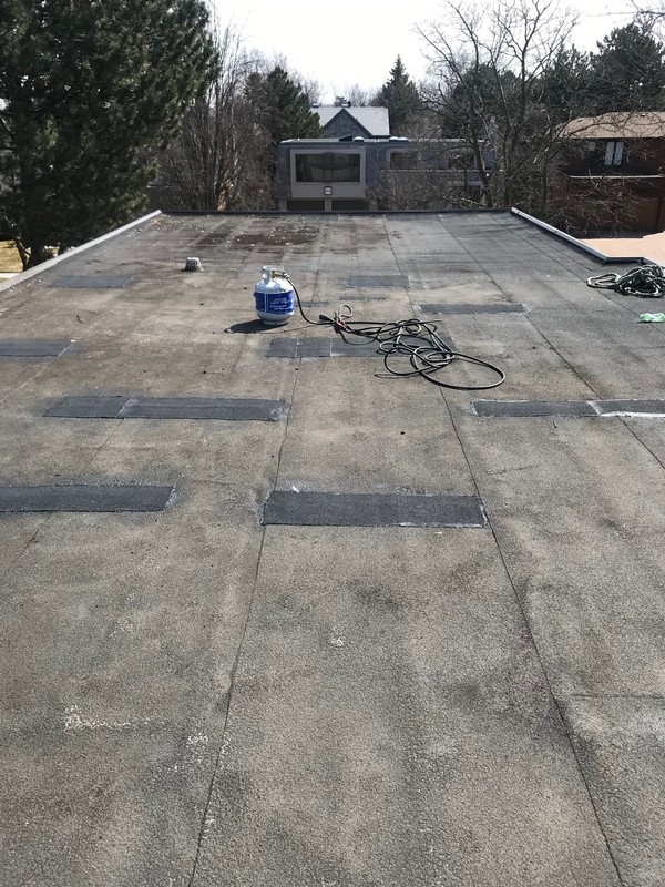 Flat roof repairs to Soprema membrane roof system on home in York Mills