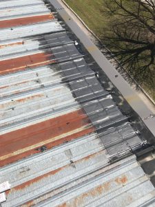 EPDM membranes repairs to flat roof on commercial building in Ajax