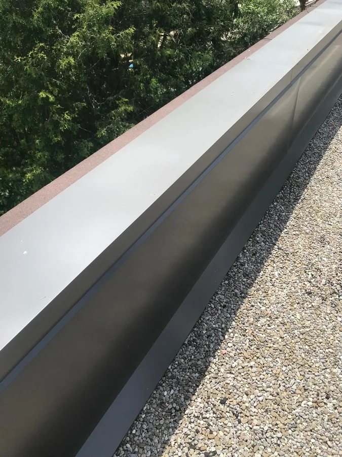 Sheet metal coping at parapet wall on commercial property in Scarborough