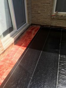 Peel and stick Soprema base membrane on flat roof in Pickering