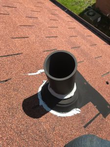 Sealing plumbing pipe with acrylic caulking on roof in Scarborough
