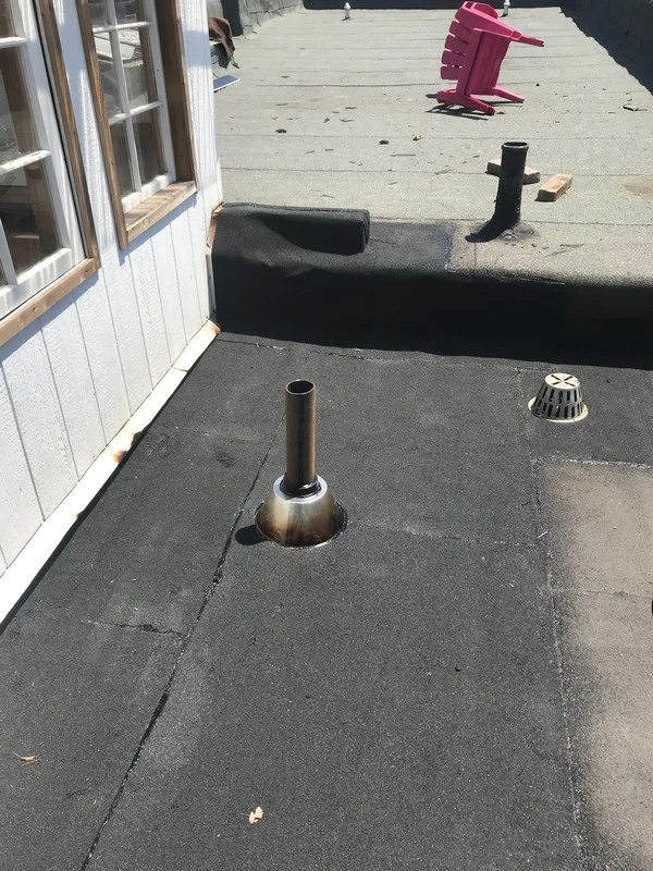 Torch applied mineral surfaced 250 cap sheet on flat roof in Toronto