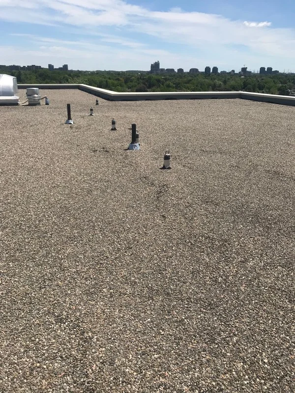 Roof repairs around roof anchors on retirement home flat roof in Vaughn