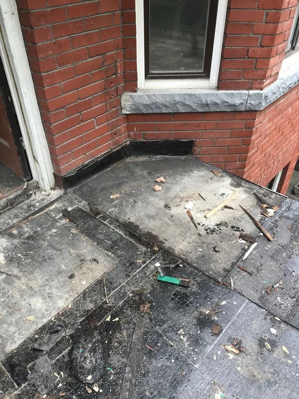 Demolition of flat roof balcony on home in Toronto
