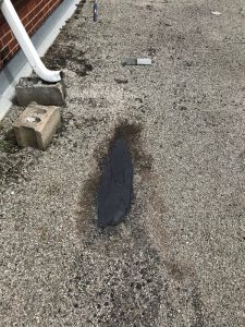 Repairs to tar and gravel flat roof on car port using roof cement in Scarborough