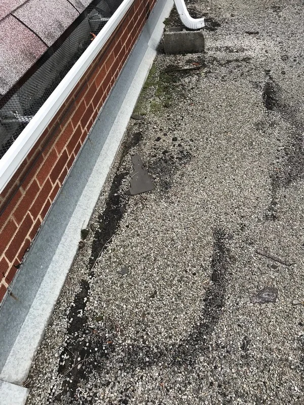 Flat roof repair at wall flashing on garage roof in Scarborough