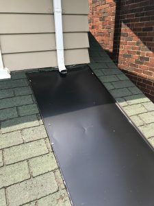 Roof repairs using custom sheet metal pan on roof in Scarborough