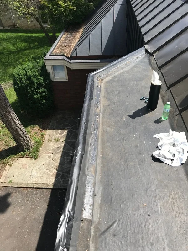 EPDM membrane repairs at parapet on flat roof in Etobicoke